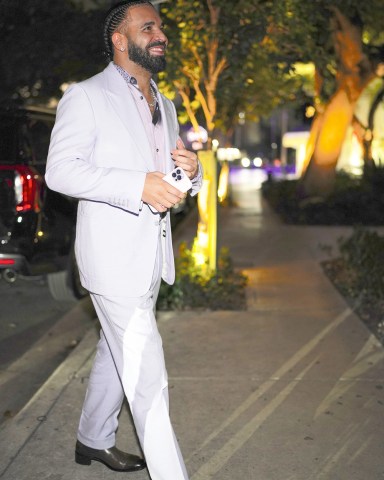 Celebrities attend Drake's 36th birthday party in Miami, FL. Drake rented out the entire restaurant Sexy Fish in Brickell for the event. Guests included DJ Khaled, Lil Baby, 21 Savage, Chaney Jones, Zack Bia, Alix Earle and Love Island stars Genny Shawcross and Emily Salch.Pictured: DrakeRef: SPL5496929 251022 NON-EXCLUSIVEPicture by: Pichichipixx / SplashNews.comSplash News and PicturesUSA: +1 310-525-5808London: +44 (0)20 8126 1009Berlin: +49 175 3764 166photodesk@splashnews.comWorld Rights