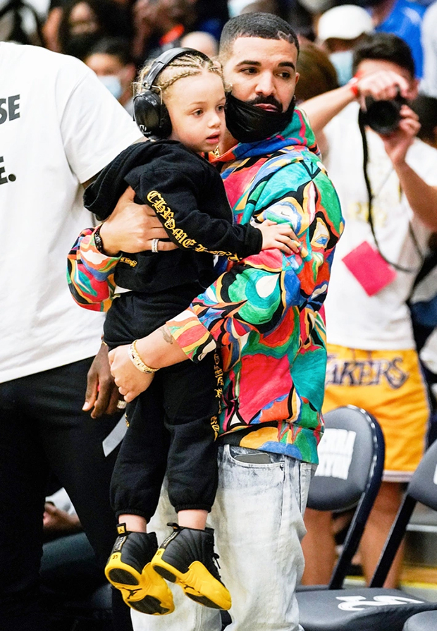 Drake and son Adonis, 5, match in leather jackets at basketball game