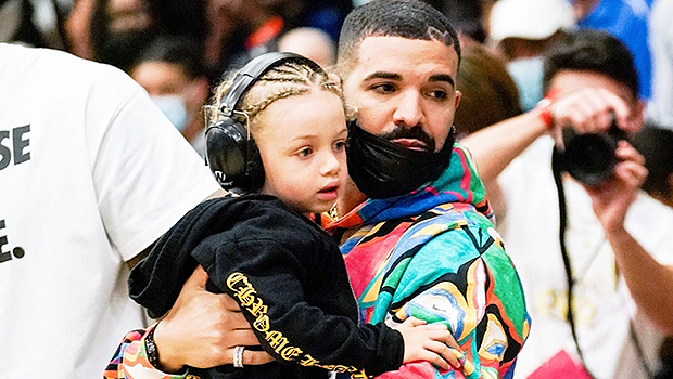 Drake and son Adonis, 5, match in leather jackets at basketball game