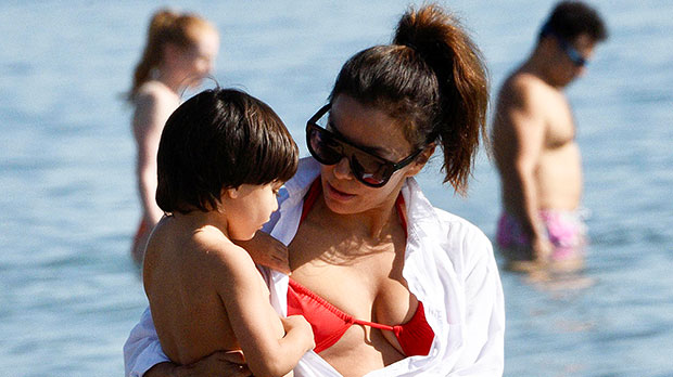 Eva Longoria wears a red bikini top and Daisy Dukes at the beach with her son Santiago, 4: photos