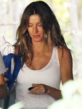 EXCLUSIVE: Gisele Bündchen ditches her wedding band as she takes her two kids to a gym in Miami amid reports she and husband Tom Brady are headed for divorce.  Wearing a white vest top and gray sweats, the 42-year-old Brazilian beauty looked downcast as she took Benjamin, 12, and nine-year-old Vivian for a workout.  The Victoria's Secret model has reportedly been staying with friends in Miami, while star quarterback Brady, 45, is back in Tampa training with his Buccaneers teammates after Hurricane Ian ravaged Florida's west coast.  Both have reportedly hired divorce attorneys and are 