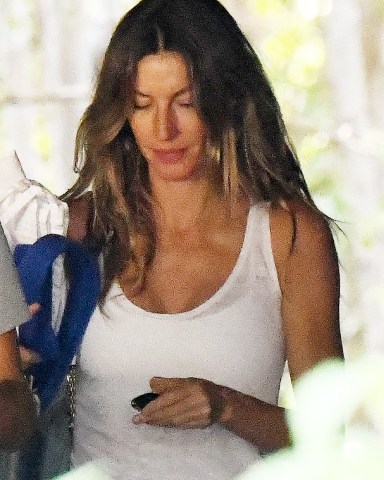EXCLUSIVE: Gisele Bündchen ditches her wedding band as she takes her two children to a gym in Miami amid reports she and husband Tom Brady are headed for divorce. The 42-year-old Brazilian beauty, wearing a white vest top and grey sweats, looked downcast as she took Benjamin, 12, and nine-year-old Vivian for a workout. The Victoria's Secret model is reported to have been staying with friends in Miami, while star quarterback Brady, 45, is back in Tampa training with his Buccaneers team mates after Hurricane Ian devastated Floria's west coast. Both are reported to have hired divorce attorneys and are “exploring their options” regarding their marriage. The pair are said to have been living apart for months. Since rumors of the tensions between the pair first emerged, multiple reports claimed that Brady's decision to U-turn on his retirement earlier this year was the trigger for their marital problems. He had initially quit his career, in part, to focus on his family - as he vowed to spend more time with them since Gisele 'deserves what she needs from me as a husband, and my kids deserve what they need from me as a dad.' Many believed that Brady re-entering the NFL became a bone of contention for Bündchen. However, their rift is completely unrelated to the former Patriots' star's football career, DailyMail.com can confirm. Bündchen is her husband's 'number one cheerleader' and said she would not care if he played until he was in his 50s. But the friction between the two has still resulted in them living apart from one another. 04 Oct 2022 Pictured: Gisele Bundchen. Photo credit: MEGA TheMegaAgency.com +1 888 505 6342