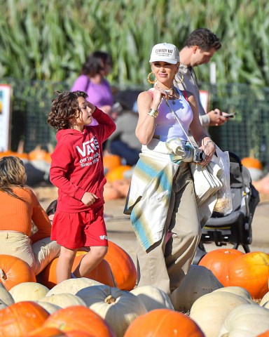 EXCLUSIVE: Gwen Stefani Took Her Boys Kingston, Zuma, & Apollo To The Pumpkin Patch At Underwood Farm In Moorpark, CA. The No Doubt Singer Stood Out In Her Fashionable Trademark OC Style As She Enjoyed The Harvest Festivities With Her Boys and Her Extended Family Including Her Parents, Her Two Brothers, And Their Kids. The Family Was Seen Enjoying Some Ice Cream And Tractor Trailer Rides. The 'I'm Just A Girl' Singer Was Also Seen Enjoying Herself As She Took Selfies And Wore Khaki Pants Along With Her Trademark Tank Top Under An Oversized Plaid Shirt and A Hat That Said 'Cowboy Hat'. Her Oldest Son Kingston Looked To Be Getting Older And Taller And Also Brought Along His Girlfriend. 23 Oct 2022 Pictured: Gwen Stefani Took Her Boys Kingston, Zuma, & Apollo To The Pumpkin Patch At Underwood Farm In Moorpark, CA. The No Doubt Singer Stood Out In Her Fashionable Trademark OC Style As She Enjoyed The Harvest Festivities With Her Boys and Her Extended Family Including Her Parents, Her Two Brothers, And Their Kids. The Family Was Seen Enjoying Some Ice Cream And Tractor Trailer Rides. The 'I'm Just A Girl' Singer Was Also Seen Enjoying Herself As She Took Selfies And Wore Khaki Pants Along With Her Trademark Tank Top Under An Oversized Plaid Shirt and A Hat That Said 'Cowboy Hat'. Her Oldest Son Kingston Looked To Be Getting Older And Taller And Also Brought Along His Girlfriend. Photo credit: @CelebCandidly / MEGA TheMegaAgency.com +1 888 505 6342 (Mega Agency TagID: MEGA910784_001.jpg) [Photo via Mega Agency]