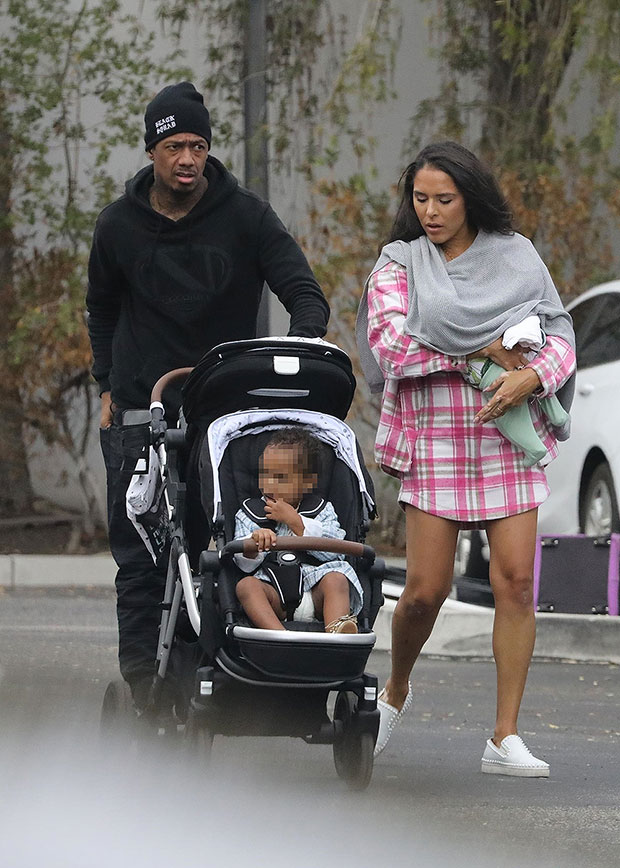 Nick Cannon, Brittany Bell Bring Baby Rise To Basketball Game Photos