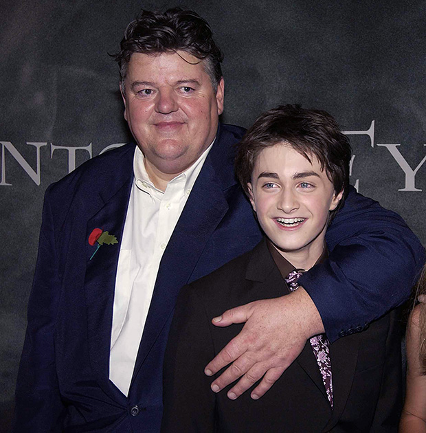 Robbie COltrane and Daniel Radcliffe pose on the red carpet together at a 'Harry Potter' premiere