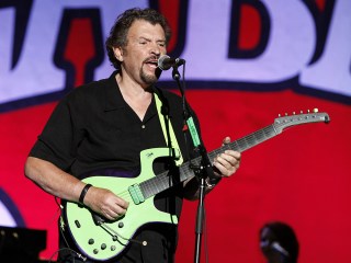 Jeff Cook of Alabama performs as part of the Alabama Tour at Verizon Wireless Amphitheater on in Alpharetta, Ga
Alabama In Concert - , Ga, Alpharetta, USA