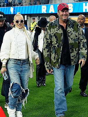 Singers Gwen Stefani and husband Blake Shelton walk off the field after an  NFL football game between the Los Angeles Rams and the Arizona Cardinals  Sunday, Nov. 13, 2022, in Inglewood, Calif. (