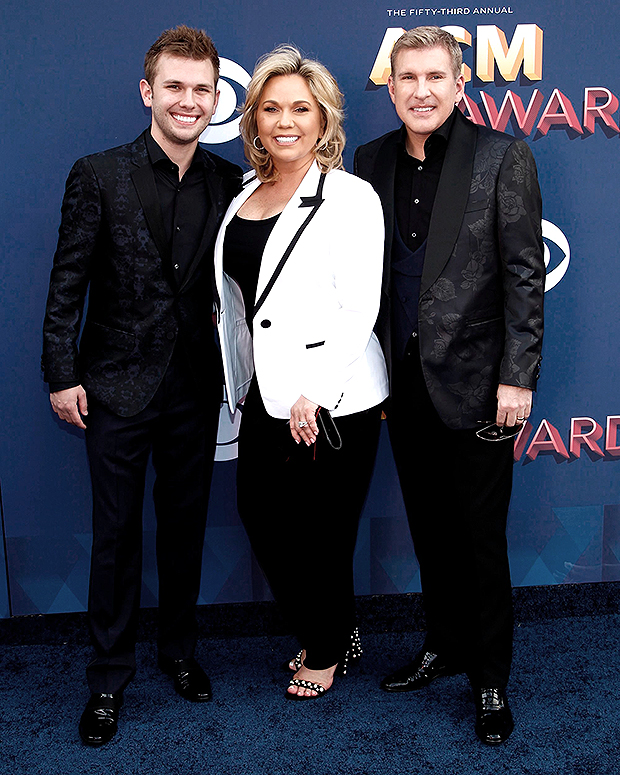 Chase Chrisley poses with his parents, Julie and Todd Chrisley at the 53rd Annual Academy of Country Music Awards in 2018 (Photo: Shutterstock)