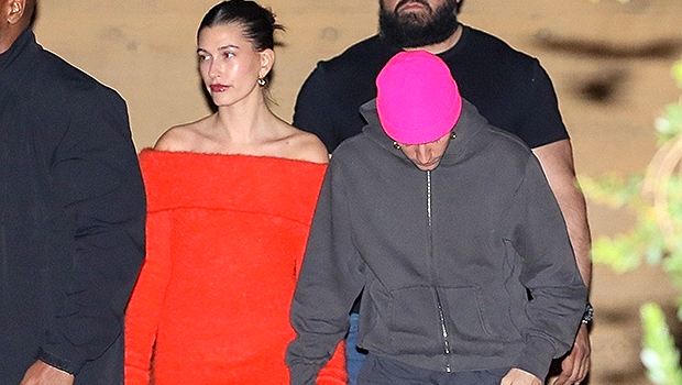 Hailey Bieber wears a skimpy red mini dress and holds Justin Bieber's hand after dinner with Kendall Jenner