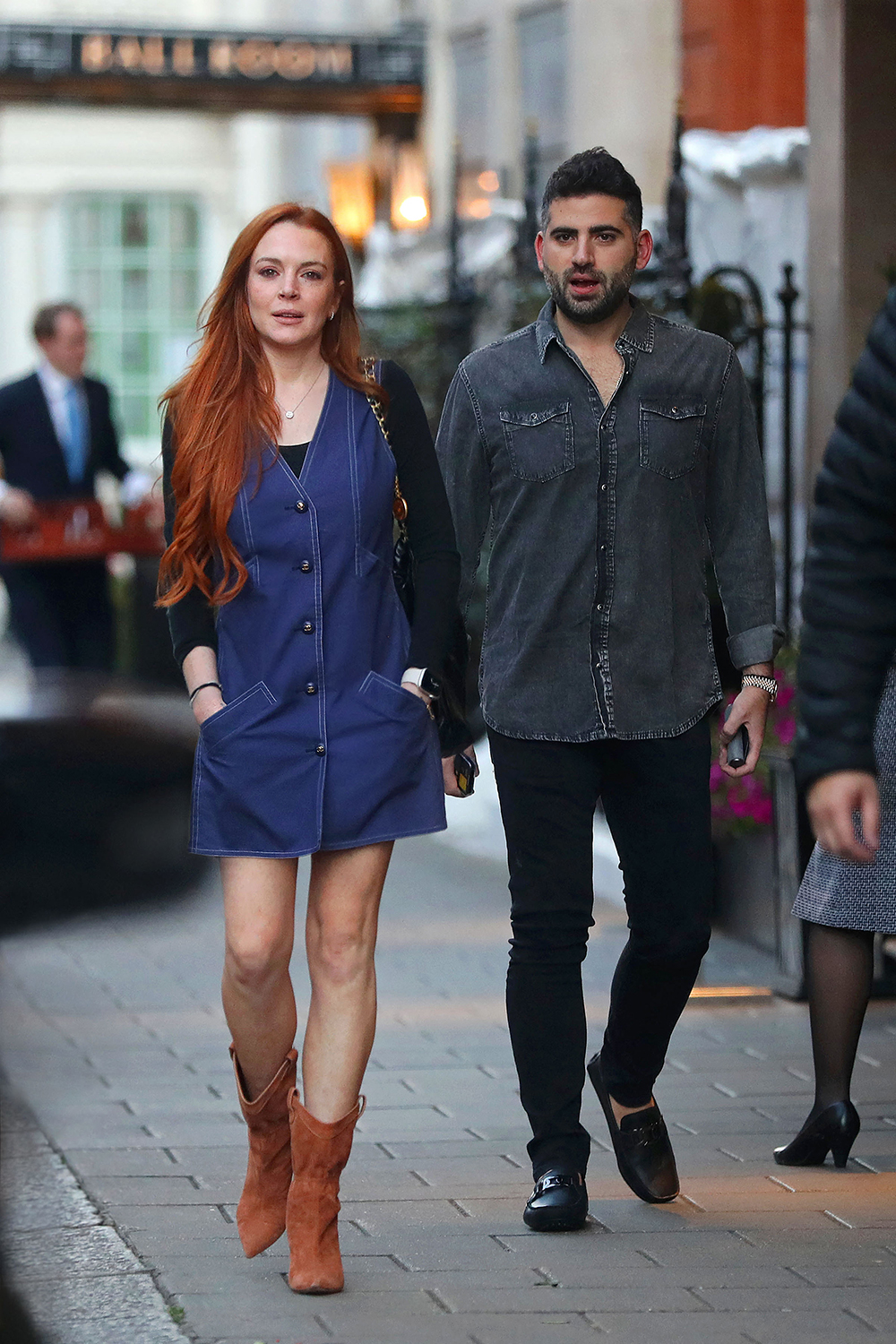 EXCLUSIVE: Lindsay Lohan looks so happy and healthy as she steps out with her new husband Bader Shammas in her first open public appearance together in London after secretly getting married. Lohan put on a radiant display as she joined her husband Bader Shammas for a day out in London. The actress, 36, looked sensational in a button-up sleeveless Chanel dress and handbag and suede ankle boots as she strolled through the capital. The newlyweds were beaming as they took the time to snap some selfies with fans. Shammas is the vice president at Dubai-based Credit Suisse bank. 24 Aug 2022 Pictured: Lindsay Lohan, Bader Shammas. Photo credit: MEGA TheMegaAgency.com +1 888 505 6342 (Mega Agency TagID: MEGA889196_001.jpg) [Photo via Mega Agency]