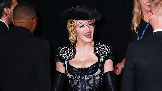 Madonna Poses Topless In New Bathroom Photos As She Bites On $3K Balenciaga Purse