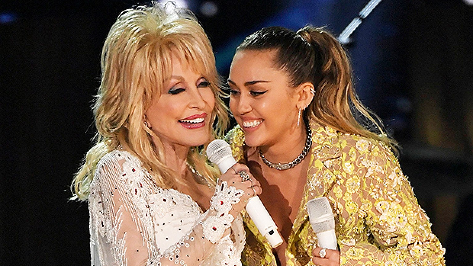 Miley Cyrus In Black Mini Dress With Dolly Parton In Nye Promo Video Hollywood Life 