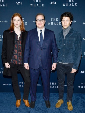 Actor Brendan Fraser, center, poses with his sons Leland Fraser, left, and Holden Fraser attend the premiere of 