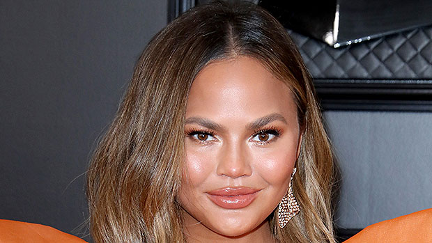 Exhausted Chrissy Teigen Puts Her Feet Up On Counter & Bump On Display After Thanksgiving