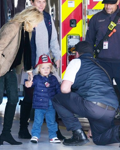 First Lady Jill Biden, left, holds the hand of her grandson Beau Biden, as they and President Joe Biden visit with firefighters on Thanksgiving Day at the Nantucket Fire Department in Nantucket, Mass
Biden, Nantucket, United States - 24 Nov 2022