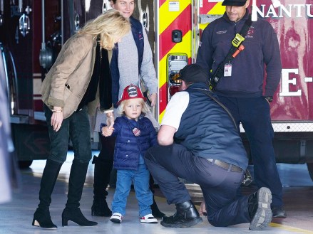 First Lady Jill Biden, left, holds the hand of her grandson Beau Biden, as they and President Joe Biden visit with firefighters on Thanksgiving Day at the Nantucket Fire Department in Nantucket, Mass. Biden, Nantucket, United States - 24 Nov 2022