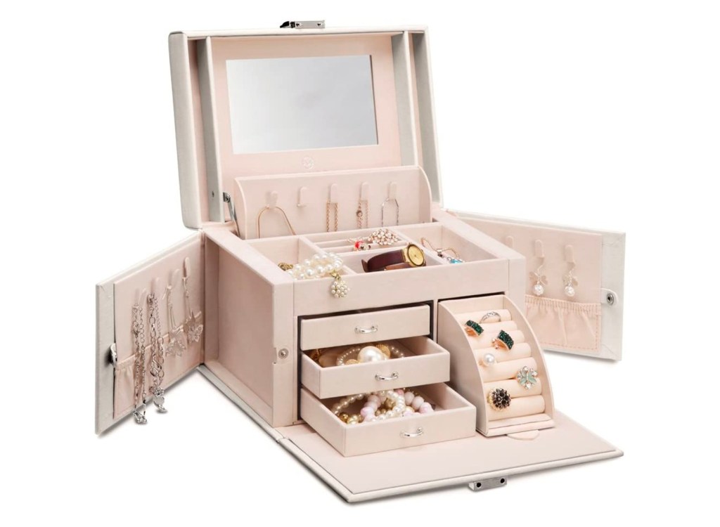 A white mirrored jewelry box with several compartments