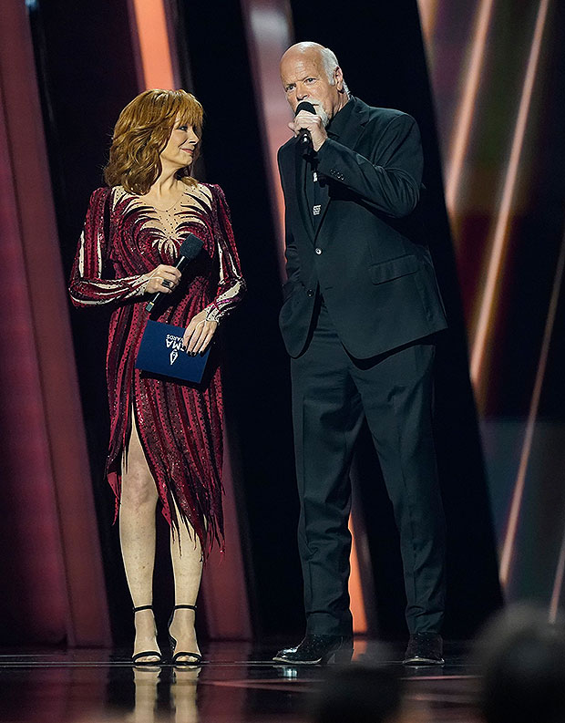 Reba McEntire stuns in a blue velvet dress, red sequin dress and more