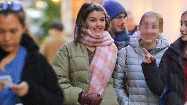 Suri Cruise, 16, Is Stylish In Puffer Coat & Jeans While Out With Friends In NYC