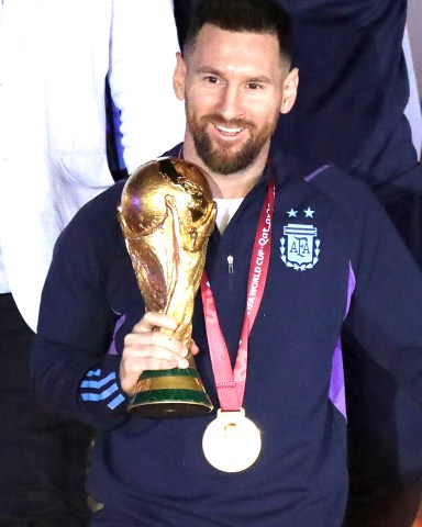 Lionel Messi of the Argentina national soccer team holds the trophy of Qatar 2022 World Cup upon the team's arrival to the International Airport of Ezeiza, some 22km of Buenos Aires, Argentina, 20 December 2022.
World Cup winner Argentina returns to Buenos Aires, Ezeiza - 20 Dec 2022