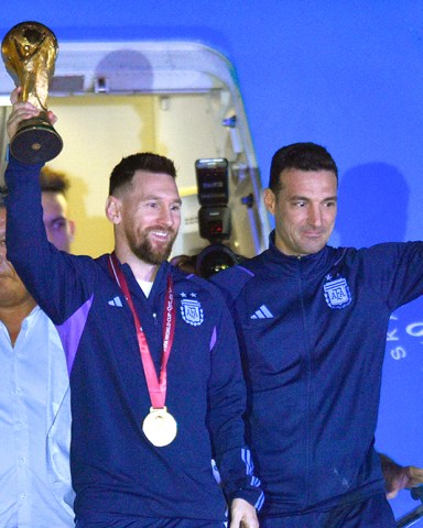 Lionel Messi holds the FIFA World Cup trophy as he deplanes, with coach Lionel Scaloni, in Buenos Aires, Argentina
Wcup Soccer, Buenos Aires, Argentina - 20 Dec 2022