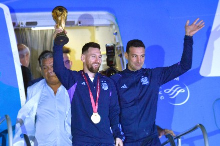 Lionel Messi holds the FIFA World Cup trophy as he deplanes, with coach Lionel Scaloni, in Buenos Aires, Argentina
Wcup Soccer, Buenos Aires, Argentina - 20 Dec 2022