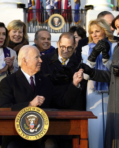 U.S. President Joe Biden signs the Respect for Marriage Acton during a ceremony on the South Lawn of the White House in Washington, DC on Tuesday, December 13, 2022.   The law codifies same-sex and interracial marriages.
Joe Biden Signs the Respect for Marriage Acton, Washington, District of Columbia, United States - 13 Dec 2022