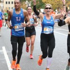 Amy Robach And T.J. Holmes Run Through Harlem In The New York City Marathon