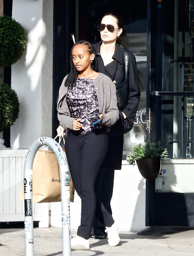 Angelina Jolie Goes Holiday Shopping With Daughter Zahara Wearing