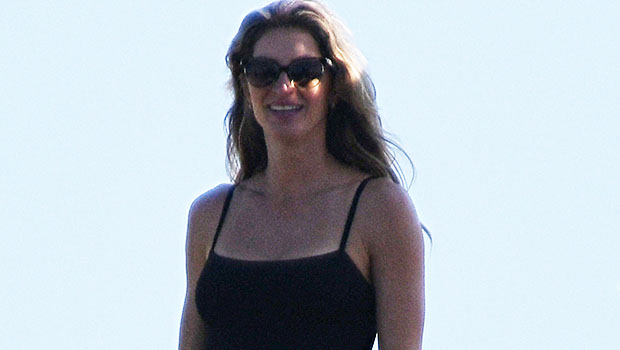 Gisele Bundchen stuns in a black swimsuit as she treats her son Benjamin, 13, to the water park