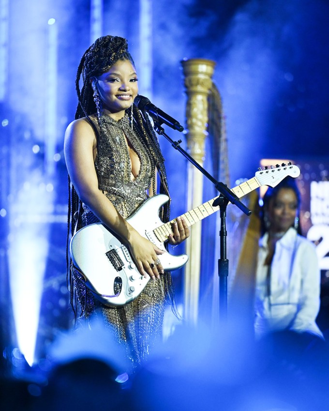 Halle Bailey with a guitar