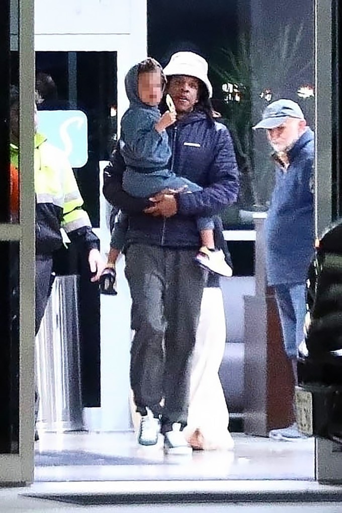 Jay-Z holding his child
