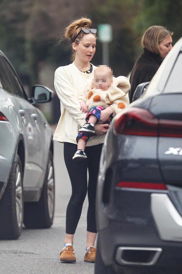 Jennifer Lawrence cradles her toddler son Cy during post-Christmas