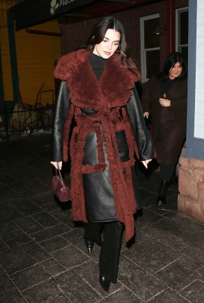 Aspen, CO - *EXCLUSIVE* -Kylie and Kendall Jenner enjoy a night out at 'Matsuhisa' Sushi Restaurant in Aspen Colorado. The sisters put on a very stylish display as they stepped out together for dinner on Sunday for a girl's night out.  Kylie stepped out in jeans, a white collared top with buttons and a fur bucket hat.  Kendall put on a chic display in all black and a leather coat with fur lining.  Pictured: Kendall Jenner BACKGRID USA 12 DECEMBER 2022 BYLINE MUST READ: 1 / BACKGRID USA: +1 310 798 9111 / usasales@backgrid.com UK: +44 208 344 2007 / uksales@backgrid.com *UK Clients - Pictures Containing Children Please Pixelate Face Prior To Publication*