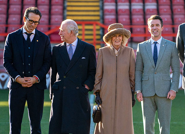 King Charles III and The Queen Consort Camilla visit Wrexham Association Football Club and are joined by the clubs owners Ryan Reynolds and Rob McElhenney the day after the Netflix Harry and Meghan documentary aired. 09 Dec 2022 Pictured: King Charles III and The Queen Consort Camilla visit Wrexham Association Football Club and are joined by the clubs owners Ryan Reynolds and Rob McElhenney the day after the Netflix Harry and Meghan documentary aired. Photo credit: News Licensing / MEGA TheMegaAgency.com +1 888 505 6342 (Mega Agency TagID: MEGA924721_001.jpg) [Photo via Mega Agency]