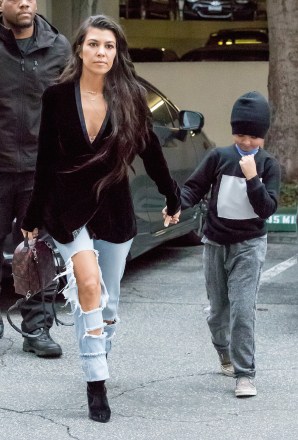 Kylie Jenner Pops in Retro-Inspired Leather Coat & Boots in Aspen – Footwear  News