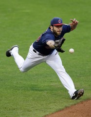 T.J. House Cleveland Indians relief pitcher T.J. House tosses the ball to first baseman Lonnie Chisenhall to get Boston Red Sox's Brock Holt out in the fifth inning of a baseball game, in Cleveland
Red Sox Indians Baseball, Cleveland, USA