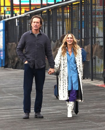 Sarah Jessica Parker and John Corbett seen walking holding hands while filming scenes for And Just Like That in Coney Island Brooklyn.  21 Feb 2023 Pictured: Sarah Jessica Parker and John Corbett seen walking holding hands while filming scenes for And Just Like That in Coney Island Brooklyn, NY.  Photo credit: Eric Kowalsky / MEGA TheMegaAgency.com +1 888 505 6342 (Mega Agency TagID: MEGA945659_014.jpg) [Photo via Mega Agency]