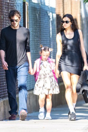 New York, NY  - *EXCLUSIVE*  - Irina Shayk spotted for the first time amid reports Jeffrey Epstein had scheduled to meet her in 2012. The top model was seen stepping out with Bradley Cooper and their daughter this morning. The Russian model  stepped out in a black tank dress, sneakers, sunnies and large hoops as she held hands with her daughter with a scruffy Cooper on the other side.Pictured: Irina Shayk, Bradley CooperBACKGRID USA 1 JUNE 2023 USA: +1 310 798 9111 / usasales@backgrid.comUK: +44 208 344 2007 / uksales@backgrid.com*UK Clients - Pictures Containing ChildrenPlease Pixelate Face Prior To Publication*