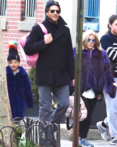 New York, NY  - *EXCLUSIVE*  - Bradley Cooper is seen with his mother Gloria and his daughter walking home after school in Manhattan’s West Village neighborhood.Pictured: Bradley CooperBACKGRID USA 20 MARCH 2023 BYLINE MUST READ: BrosNYC / BACKGRIDUSA: +1 310 798 9111 / usasales@backgrid.comUK: +44 208 344 2007 / uksales@backgrid.com*UK Clients - Pictures Containing ChildrenPlease Pixelate Face Prior To Publication*