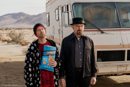 Breaking Bad duo Walter White and Jesse Pinkman are back together after 10 years as Bryan Cranston and Aaron Paul star in PopCorners’ first Super Bowl commercial. The hit show ended a decade ago but the beloved characters are teaming up again - and this time with a tasty twist. Instead of cooking crystal meth, they are now working on batches of air-popped Popcorners chips in a spot titled “Breaking Good” which will air on Sunday (FEBRUARY 12) during the Big Game. The ad features the infamous RV from the series and also sees the return of Raymond Cruz as Tuco Salamanca, with “Breaking Bad” creator, head writer, executive producer and director Vince Gilligan reuniting with the cast too. Cranston said: “PopCorners’ desire to create a genuine extension of the franchise and a campaign that would really excite ‘Breaking Bad’ fans is what brought us back for this Super Bowl commercial. ““Walt would’ve been immediately drawn to the basic ingredients in PopCorners, so ‘Breaking Good’ made perfect sense as an alternate storyline that would’ve been much better for him and Jesse.” Paul added: ““There’s nothing better than getting to revive characters who mean so much to us, surrounded by so many of our original cast and crew members, for the most exciting sports event of the year. ““We’re grateful that PopCorners gave us the perfect opportunity to reunite our ‘Breaking Bad’ family, especially with a brand that I think is about to become everyone’s go-to snack.” Brett O'Brien, chief marketing officer at Frito-Lay North America, said. “We’re showcasing why fans love this air-popped, never fried snack in an exciting and unexpected way through the lens of two characters who could’ve used their talents to Break Into Something Good.” *BYLINE: Frito-Lay/Mega. 06 Feb 2023 Pictured: Bryan Cranston and Aaron Paul return as Breaking Bad's Walter White and Jesse Pinkman in PopCorners’ Super Bowl commercial. *BYLINE: Frito-La