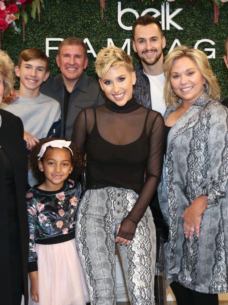 FRANKLIN, TENNESSEE - NOVEMBER 05: (L-R front) Faye Chrisley, Chloe Chrisley, Savannah Chrisley, Julie Chrisley, Chase Chrisley (L-R Back row) Grayson Chrisley, Todd Chrisley and Nic Kerdiles pose during a personal appearance by Savannah Chrisley at Belk at Cool Springs Galleria Mall on November 05, 2019 in Franklin, Tennessee. (Photo by Terry Wyatt/Getty Images for Rampage )