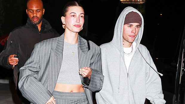 Hailey Bieber Wears an Oversized Pinstripe Suit and Crop Top and Husband Justin Twins in Oversized Jeans