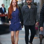 EXCLUSIVE: Lindsay Lohan looks so happy and healthy as she steps out with new husband Bader Shammas in first open public appearance together in London after secretly tying the knot