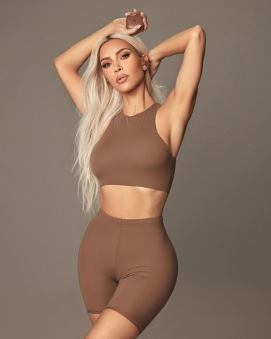 Kim Kardashian has teamed up with Beats by Dre to launch a new “Beats x Kim” collection of wireless airbuds in her signature minimalistic style. The custom collaboration for Beats Fit Pro features three neutral colours - Moon (light), Dune (Medium) and Earth (deep) - designed for both music fans and fashion lovers. Kim said: “I wanted to break away from the idea that headphones have to be colorful to make a statement. “This collaboration is special because it allows you to blend in or stand out, and Beats is known for creating products that showcase individuality.” Beats x Kim’s versatile hues and innovative wingtip design make them perfect for all of the days activities, from the gym to the office. Eddy Cue, Apple’s senior vice president of Services, said: “Kim brought her signature minimalist style to the first-ever Beats Fit Pro custom headphones. “We’re excited to offer Beats’ most innovative headphones in a whole new, gorgeous color palette to music fans and fashion lovers alike.” Beats Fit Pro are the most advanced and innovative Beats earphones to date, providing a premium sound experience with Active Noise Cancellation, Transparency and Adaptive EQ modes. Beats x Kim will be available to buy online in the US, Canada, UK, France, Germany and Japan from Tuesday, August 16 at Apple.com/kim, priced at $199.99. The collaboration will be available in limited quantities at select Apple Store locations and exclusive authorised resellers from Wednesday, August 17. *BYLINE: Beats x Kim/Mega. 09 Aug 2022 Pictured: Kim Kardashian launches her "Beats x Kim" collaboration with Beats by Dre, wearing wireless airbuds in neutral colour "Earth". *BYLINE: Beats x Kim/Mega. Photo credit: Beats x Kim/Mega TheMegaAgency.com +1 888 505 6342 (Mega Agency TagID: MEGA885317_002.jpg) [Photo via Mega Agency]