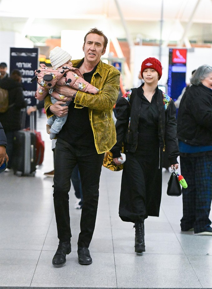 Nicolas Cage with daughter August and wife Riko Shibata arrive at JFK airport in NYC