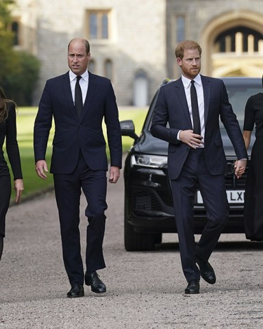 From left, Kate, the Princess of Wales, Prince William, Prince of Wales, Prince Harry and Meghan, Duchess of Sussex walk to meet members of the public at Windsor Castle, following the death of Queen Elizabeth II on Thursday, in Windsor, England
Royals, Windsor, United Kingdom - 10 Sep 2022