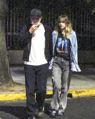 Argentina, ARGENTINA  - *EXCLUSIVE*  - Robert Pattinson went to dinner incognito with his girlfriend Suki Waterhouse and their local friend and hostess. The actor had arrived in the city 3 days ago to wait for his partner who appeared on Friday at the Lollapalooza festival. Both he and her friend accompanied her and were behind the scenes when the model, singer and actress gave her show at the Lollapalooza Festival. There, when she finished, she thanked the Argentine public and said "it was the best show of my life. I will never forget it, I love you”. Later, back in the Palermo neighborhood, they decided to go to dinner together, where they walked hand in hand. They chose to try typical local dishes and went to a neighborhood tavern. They tried not to be recognized (he never took off his cap, not even inside the restaurant). However, it was not enough to go unnoticed in front of the other diners who got up to ask him for a photo. They refused, saying that they were resting and enjoying themselves and that they did not want to be disturbed. They they got up and returned to the apartment where they are staying until she leaves for Chile ton Saturday where she will appear in the Lollapalooza edition in that country.Pictured: Robert Pattinson, Suki WaterhouseBACKGRID USA 18 MARCH 2023 BYLINE MUST READ: The Grosby Group / BACKGRIDUSA: +1 310 798 9111 / usasales@backgrid.comUK: +44 208 344 2007 / uksales@backgrid.com*UK Clients - Pictures Containing ChildrenPlease Pixelate Face Prior To Publication*