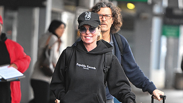 Shania Twain, 57, Seen In Very Rare Photos With Husband As She Rolls Her Own Bag At Airport