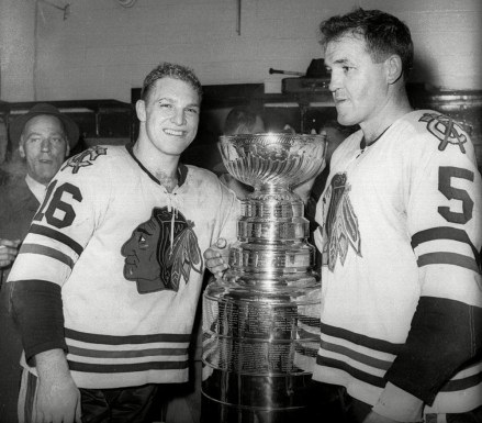 EVANS Bobby Hull, left, and Jack Evans of the Chicago Blackhawks, in the locker room with the Stanley Cup after Chicago won the NHL Championship by beating the Detroit Red Wings 5-1 in this April 16, 1961 photo, in Detroit.  Like his father Bobby, Brett Hull of the Dallas Stars will be inscribed on the Stanley Cup after scoring the winning goal in three overtimes against the Buffalo Sabers in Game 6 of the Stanley Cup final STANLEY CUP HULLS, DETROIT, USA